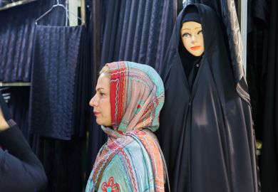 A woman in Tehran wearing a hijab