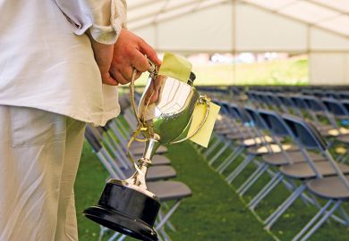 Holding a prize cup