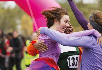 Women embrace after race