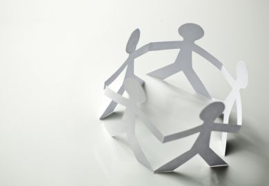 Paper people in a circle, symbolising human connection