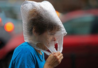 Hungarian woman wearing a plastic bag in the rain