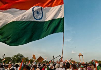 Indian flag being waved by demonstrators during protest
