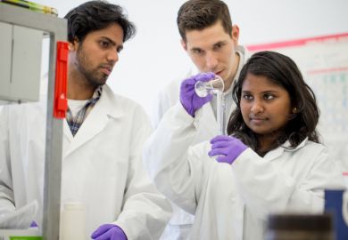 Indian scientists perform an experiment