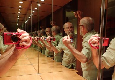 Man taking selfie of reflections in infinity mirror, illustrating tedium when conferences are dominated by authors with multiple papers. 