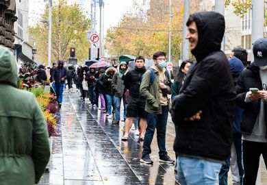  International Students are seen lined up outside the Melbourne Town Hall, Australia