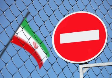 A no entry sign next to an Iranian flag symbolising restricted academic freedom