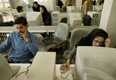 Iranian students on computers, illustrating online universities Iranian students on computers, illustrating online universities