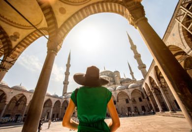 Woman at the Blue Mosque in Istanbul Woman at the Blue Mosque in Istanbul