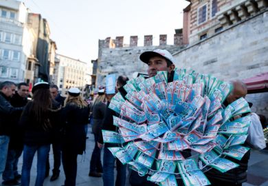 Istanbul, TURKEY - DECEMBER 15, 2012 A Man is selling New Year Lottery tickets of Turkey, It's called milli piyango Nigmet Abla