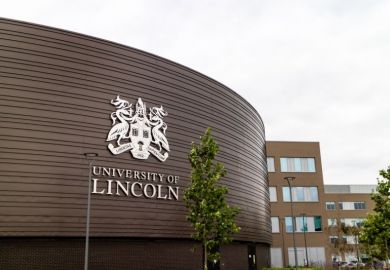 The University of Lincoln logo on one of the buildings.