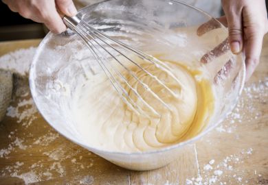 Whisk is used to mix something in a glass bowl Whisk is used to mix something in a glass bowl