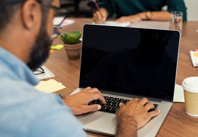 Businessman typing on blank screen