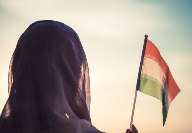 Woman waves Iranian flag