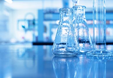 Glass flask and cylinder in lab