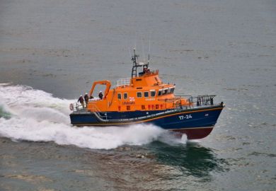 RNLI Lifeboat at sea, travelling at speed