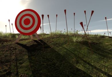 An archery target surrounded by arrows stuck in the ground