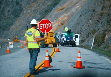 Road workers repairing the Highway #1 at the US West Coast 