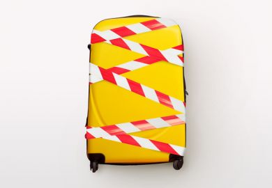 A yellow suitcase bound up with tape A yellow suitcase bound up with tape