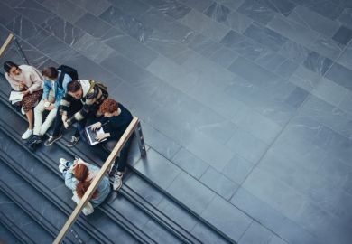 Some students gather on some steps