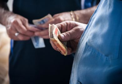 Hand of a person holding money banknotes