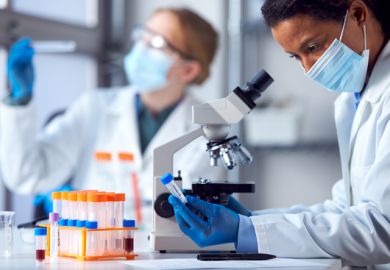 Lab workers researching the Covid-19 vaccine Lab workers researching the Covid-19 vaccine