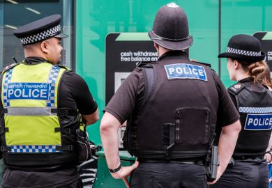 Three Police Officers Standing Patrolling For Public Safety