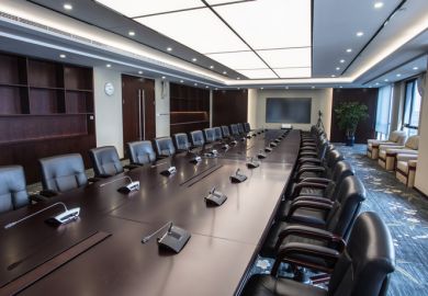 Boardroom with chairs and intercom system 