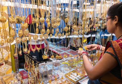Shopping at a roadside costume jewellery stall Shopping at a roadside costume jewellery stall
