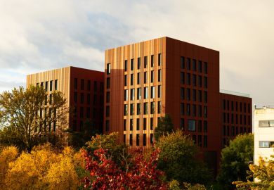View of the University of Warwick surrounded by autumn trees View of the University of Warwick surrounded by autumn trees