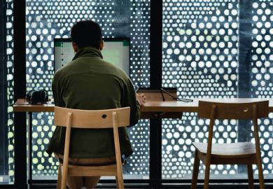 A man uses whatsapp on a computer belonging to the jakarta library.
