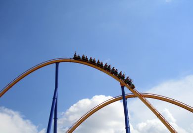 Roller coaster at the top of a rise Roller coaster at the top of a rise