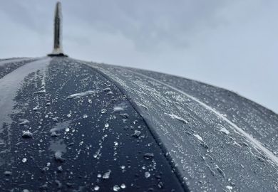 Close up of umbrella in the rain