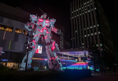 Gundam, real size model, light up at Divercity Tokyo plaza at night in Oodaiba area.