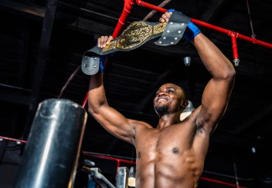 A boxer holds aloft his Lonsdale belt A boxer holds aloft his Lonsdale belt