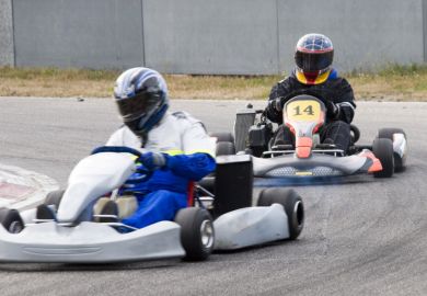 Two go-kart drivers racing