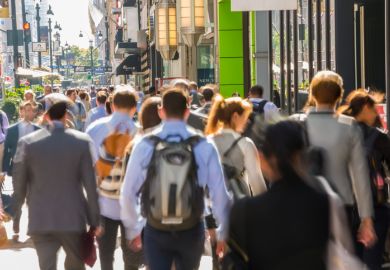 Commuters and pedestrians on busy pavement, Central Manhattan, New York, USA