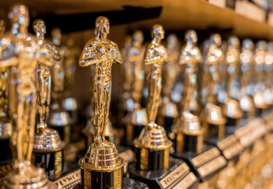 Hollywood Golden Oscar Academy Trophies Arranged On Shelf For Sale In Shop Hollywood Golden Oscar Academy Trophies Arranged On Shelf For Sale In Shop.