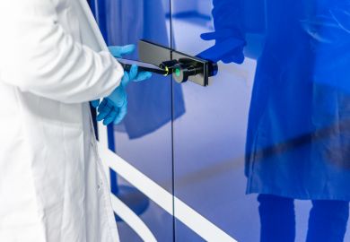 Scientist using phone to open laboratory door