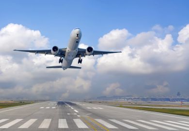 Airplane ascends into the sky after leaving the runway
