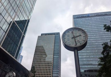 A public clock stands at Reuters Plaza before the modern glass skyscrapers, including the JP Morgan Chase building, in the Canary Wharf financial district A public clock stands at Reuters Plaza before the modern glass skyscrapers, including the JP Morgan Chase building, in the Canary Wharf financial district