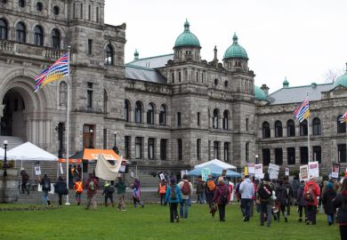 Participants in an Idle No More rally march towards the British Columbia Legislative Building Participants in an Idle No More rally march towards the British Columbia Legislative Building