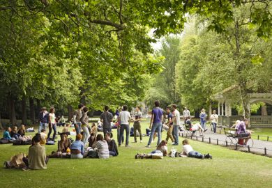 Groups of visiting students (tourists) relaxing in St Stephen\'s Green Groups of visiting students (tourists) relaxing in St Stephen\'s Green