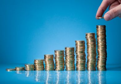 stacks of coins rising in height showing pay and tuition differentials