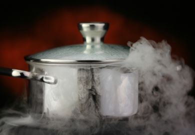 Steam escapes from boiling pot