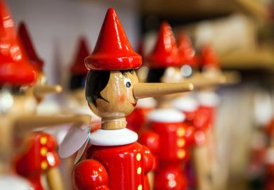 Close-up of Pinocchio puppet with long nose, indicating lying