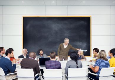 Students gathered around professor