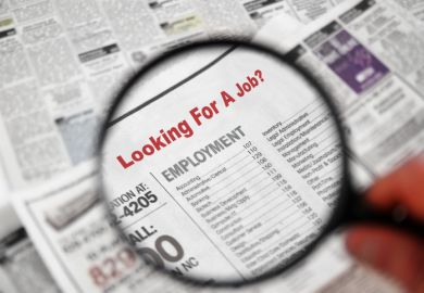 Magnifying glass searching job adverts illustrating graduate outcomes survey results