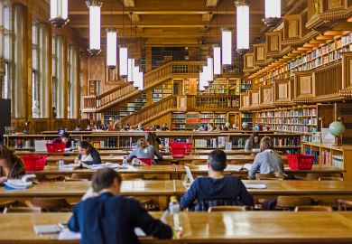 Wooden-panelled interior of a library