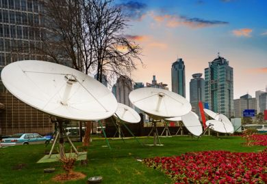 Shanghai's skyscrapers and satellite antenna.