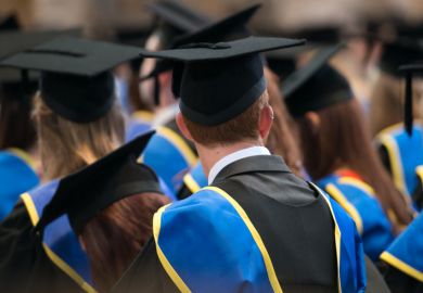Students sit in a row at their university graduation ceremony. Students sit in a row at their university graduation ceremony.